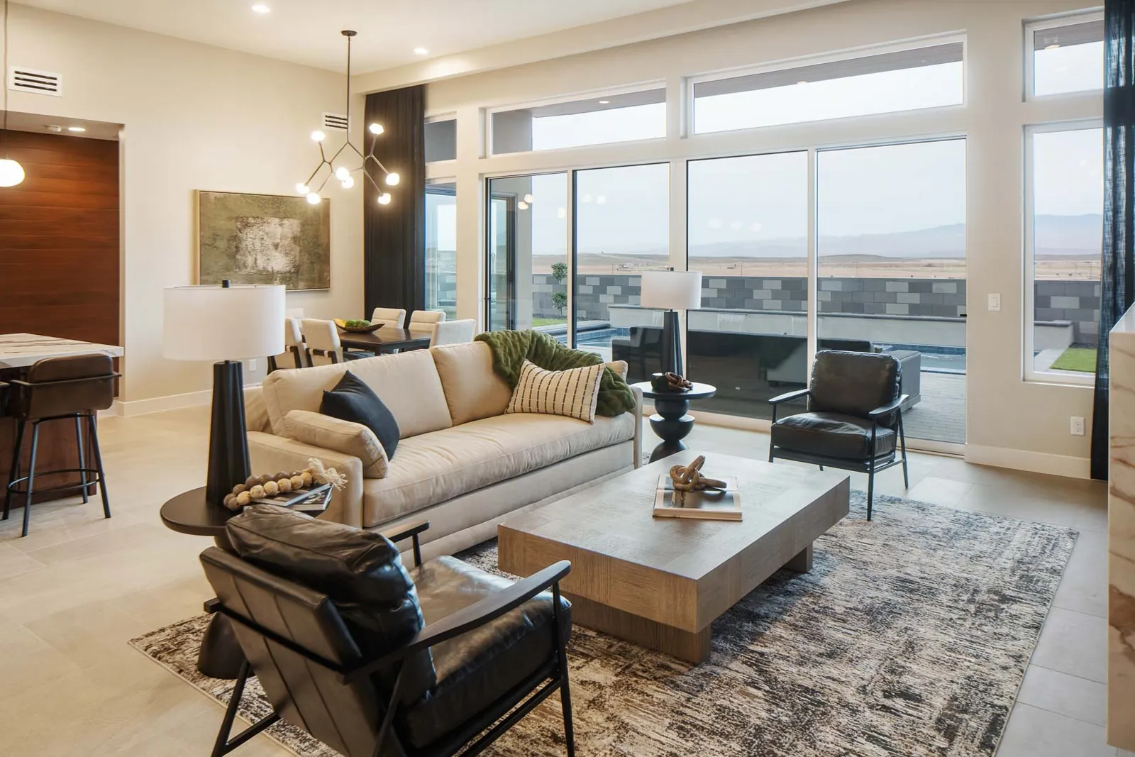 Furnished great room with a wall of windows