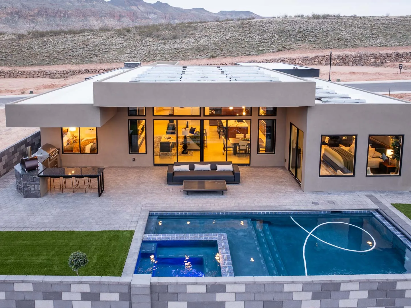 Backyard pool and patio at dusk, seen from above