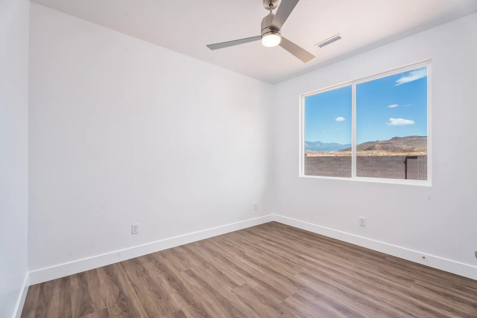 Bedroom with a window looking toward the cliffs