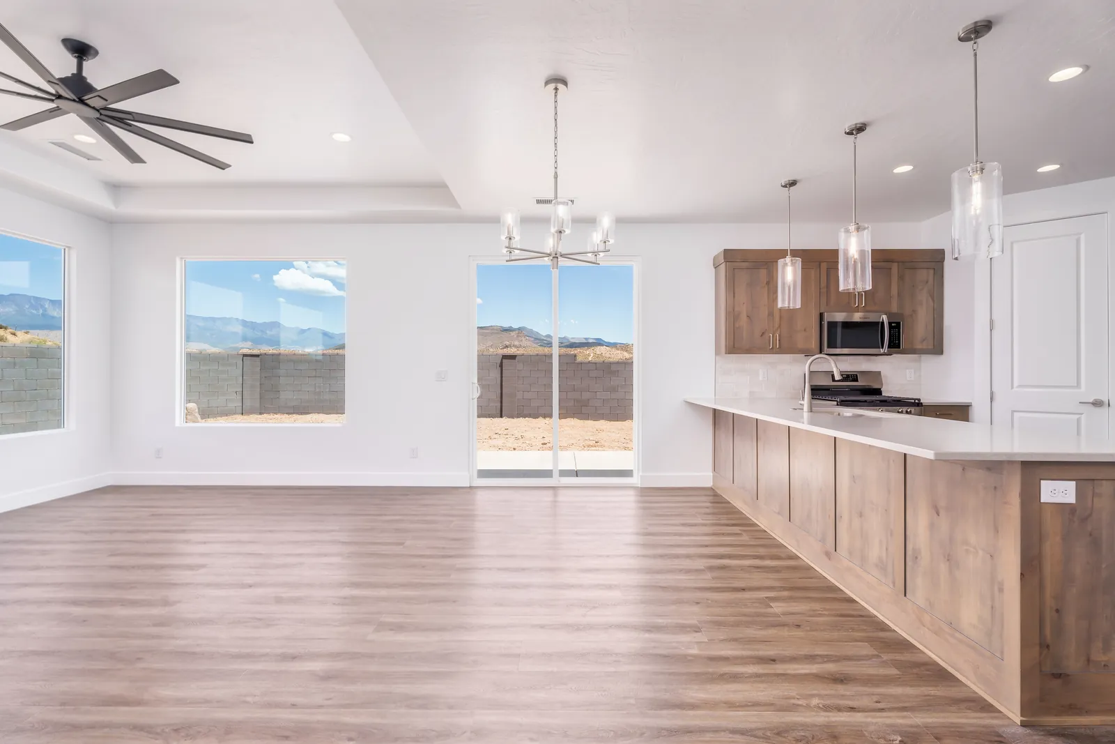 Kitchen and great room with windows onto the backyard