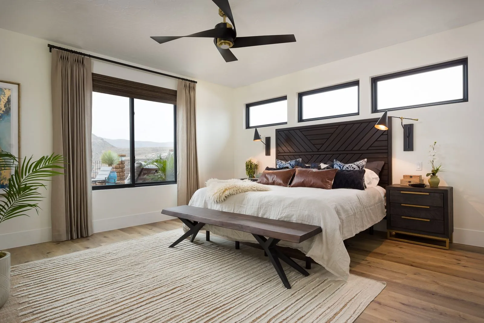 Primary bedroom with a bench at the foot of the bed