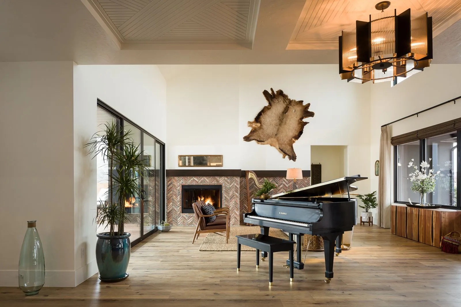 Great room with a grand piano and a fireplace
