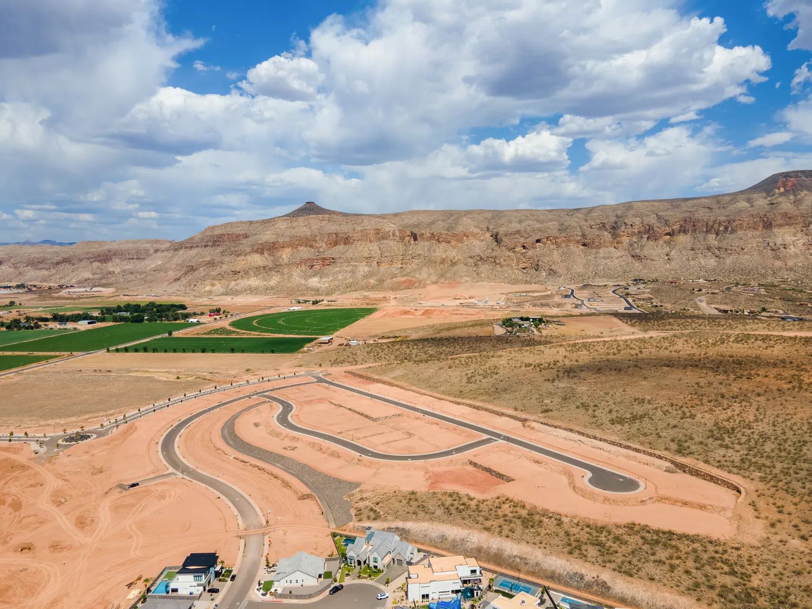 Aerial view of new road loops below a line of cliffs