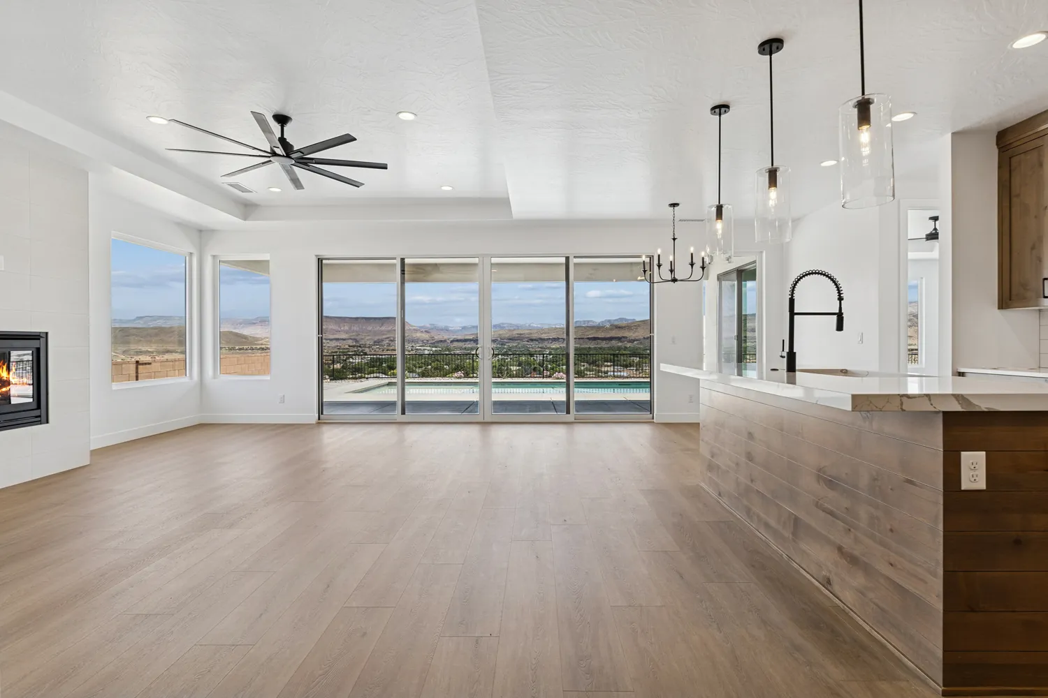 Great room with a wall of windows to the valley