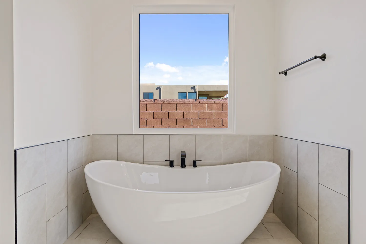 Freestanding tub under a window