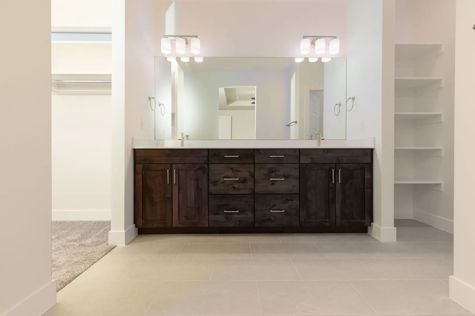 Double vanity with dark wood drawers