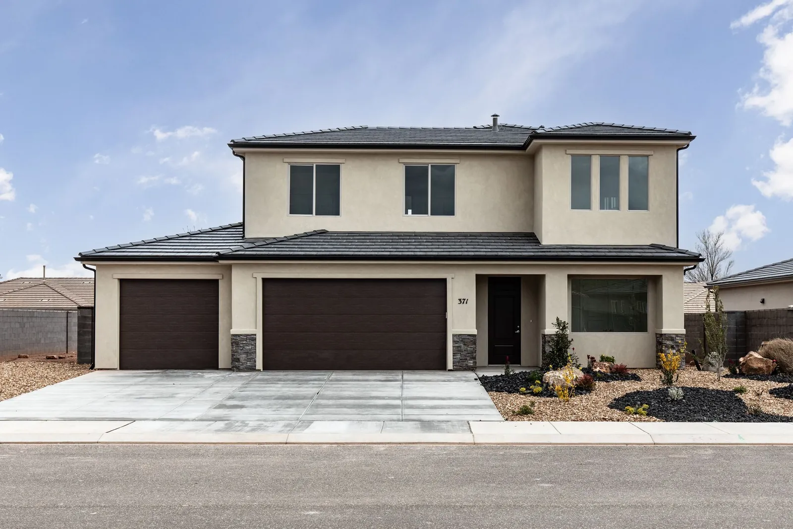 Two-story home with two garage doors