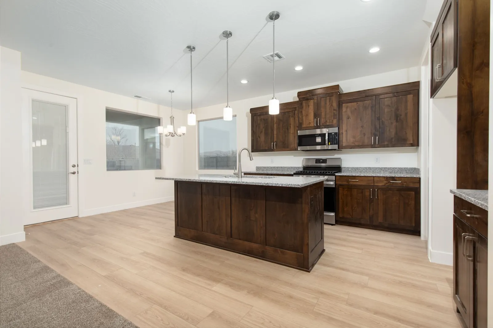 Kitchen with dark wood cabinets and an island