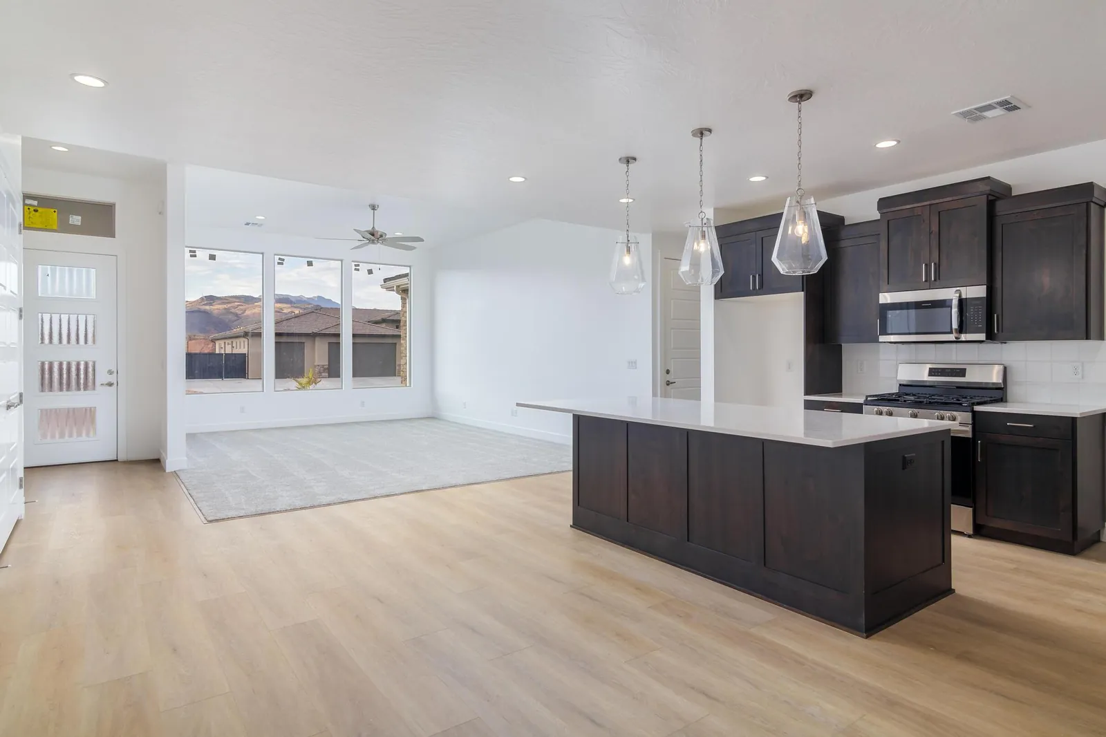 Kitchen with dark cabinets and a long island