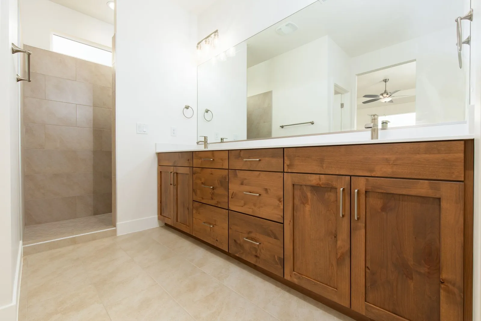 Double vanity with dark wood drawers