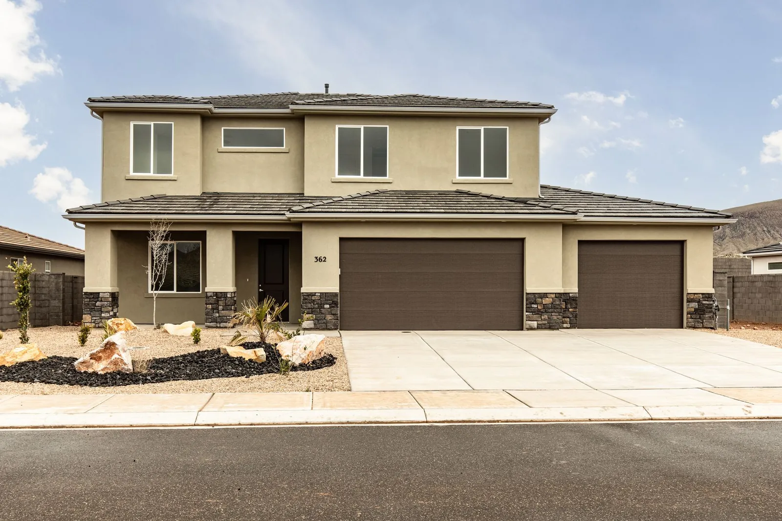 Two-story home with two garage doors