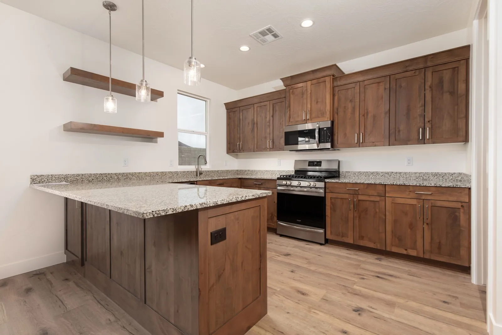 Kitchen with dark wood cabinets and floating shelves