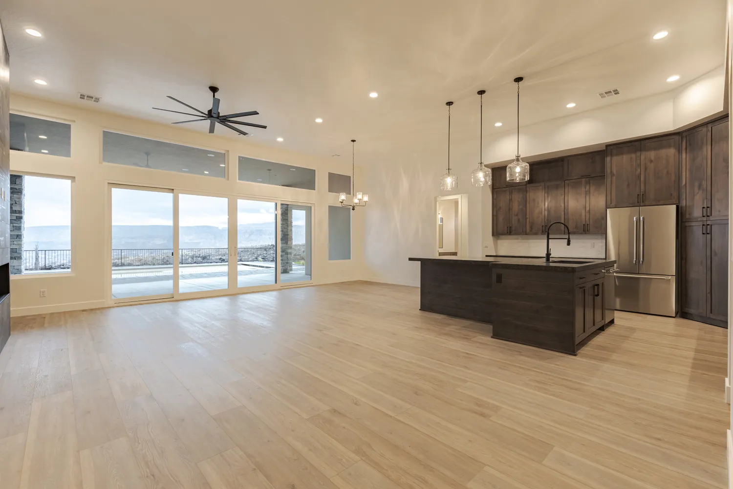 Great room with a wall of windows toward the valley