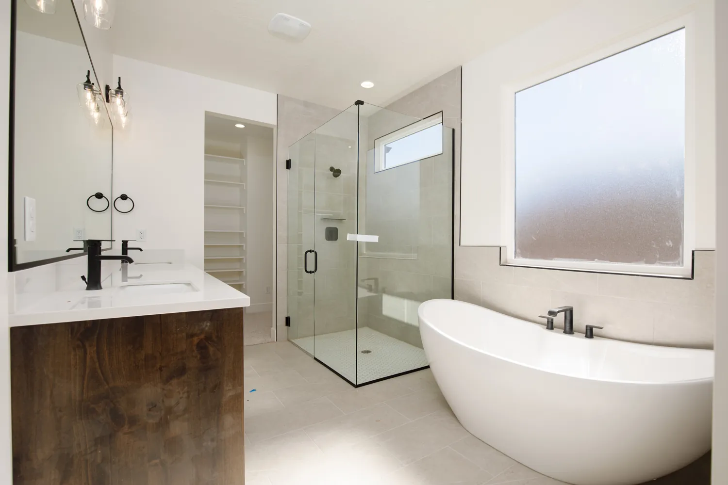 Bathroom with a freestanding tub and a glass shower