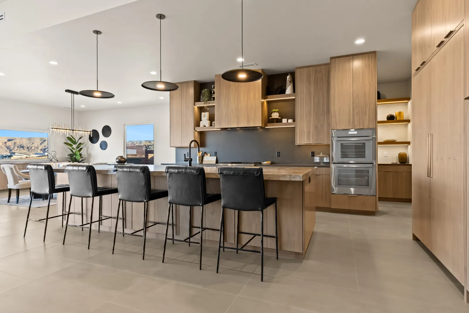 Kitchen island with bar stools and pendant lights