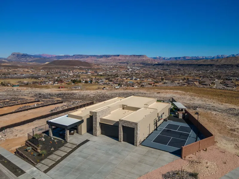 Aerial view of a home on a hilltop above the valley