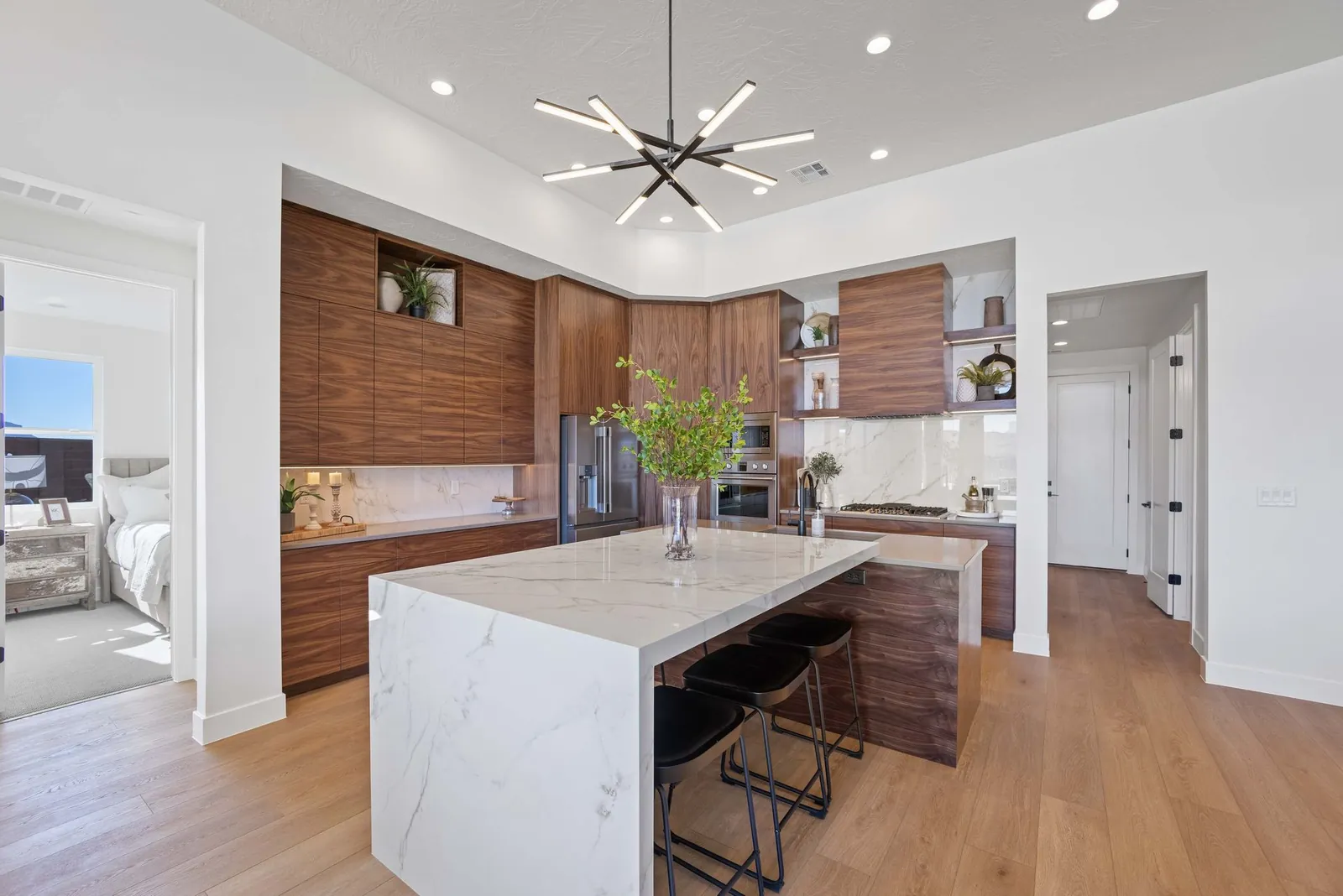 Kitchen with a white island and wood cabinets